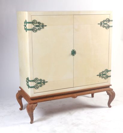 null Wooden straight bar cabinet covered with cream parchment, opening with two leaves,...