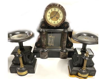 null Black and red marble veneer mantel set including a clock with a dial showing...