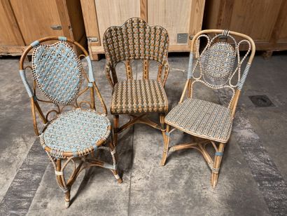null Set of three mismatched garden chairs in wood and woven polychrome wicker. 

20th...