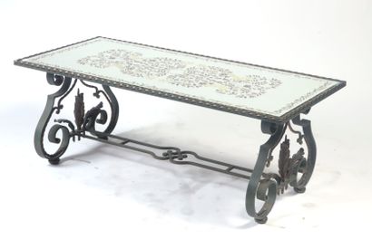 null Rectangular LOW TABLE, the wrought iron base forming scrolls underlined by acanthus...