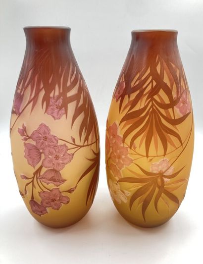 null TWO VASES in multi-layer glass with floral decorations in the orange tones....