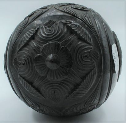 null COROZO NUT carved with two portraits in a medallion surrounded by nets in a...
