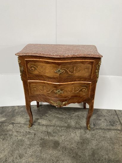 null WOODEN COMMODE opening with two drawers and resting on cambered feet. Red marble...