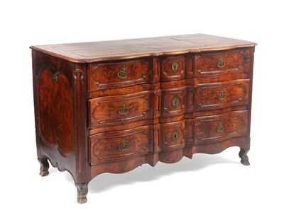null A carved oak crossbow fronted COMMODE opening to three drawers in front, resting...