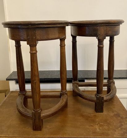 null TWO TABOURETS in stained oak resting on three baluster feet joined by three...
