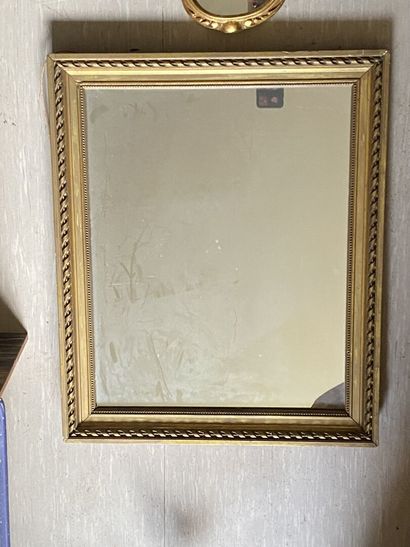 null THREE MIRRORS in wood and gilded stucco, one rectangular in the Louis XVI style...