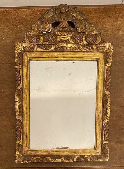 null Wood and gilded stucco pediment mirror decorated with trellis and flowers. 

19th...
