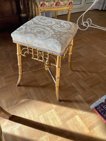 null TABOURET in gilded wood in the imitation of bamboo, resting on four feet joined...