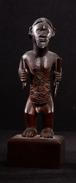 null Bembe male statuette (Congo)

The figure is represented standing, his body scarified,...