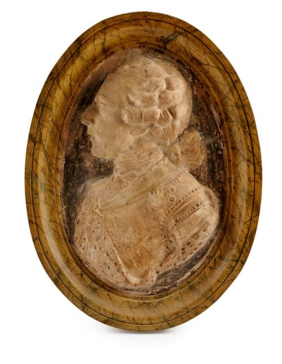 null Pair of large oval medallions in papier-mache representing a man and a woman...