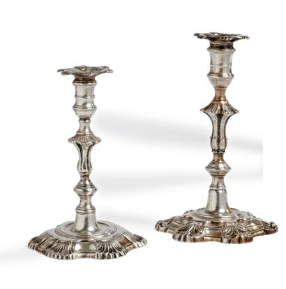 null Two silver candlesticks of toilet posing on a base with contours underlined...