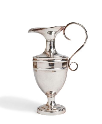 Silver plated ewer of baluster form posing...