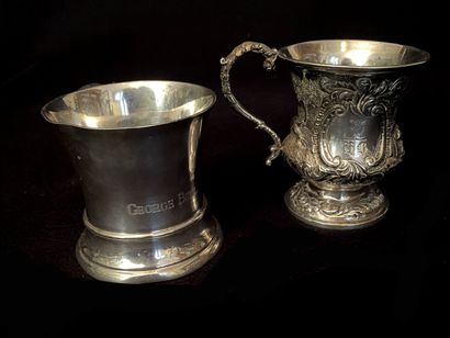 null Two cups with handle out of silver 925 thousandths :
- one of flared form, plain,...