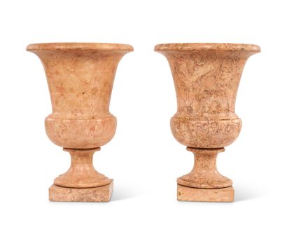Deux vases en composition imitant le marbre....