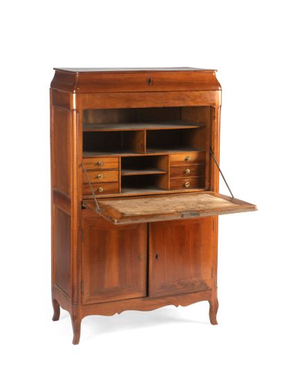 null Secretary in solid walnut with doucine. It opens with a flap topped by a drawer...