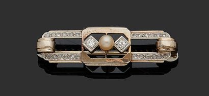 null A geometrically decorated gold brooch with a cultured pearl in the center between...