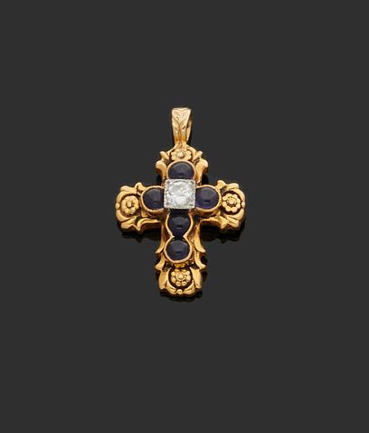 null PENDANT "cross" in yellow gold 585 thousandths decorated in the center of a...