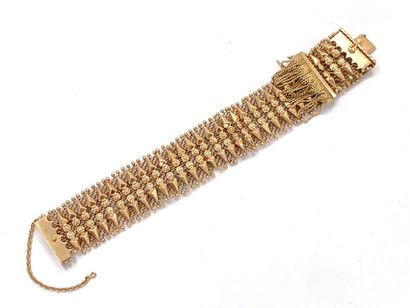 null BRACELET articulated ribbon in yellow gold 750 thousandth openwork and decorated...