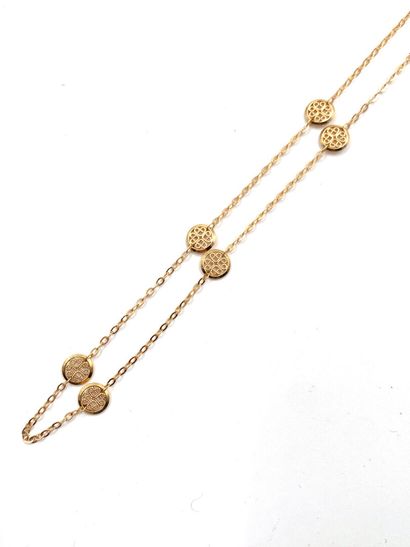 null NECKLACE articulated in yellow gold 750 thousandths, decorated with round filigree...