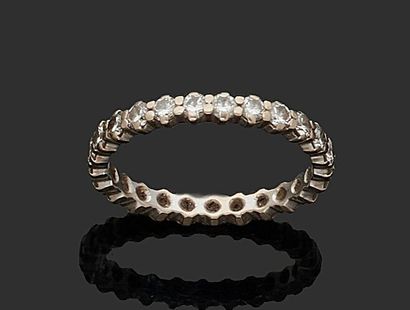 null ALLIANCE in white gold 750 thousandth entirely set with round brilliant diamonds.
(Wear).
Turn...