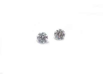 null TWO DIAMONDS on paper of round shape and brilliant cut weighing 0.55 and 0.57...