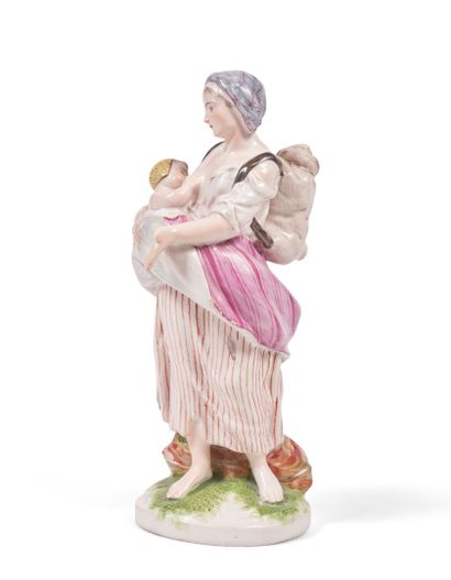 null Niderviller
Statuette en faïence représentant une jeune femme mendiant, allaitant...