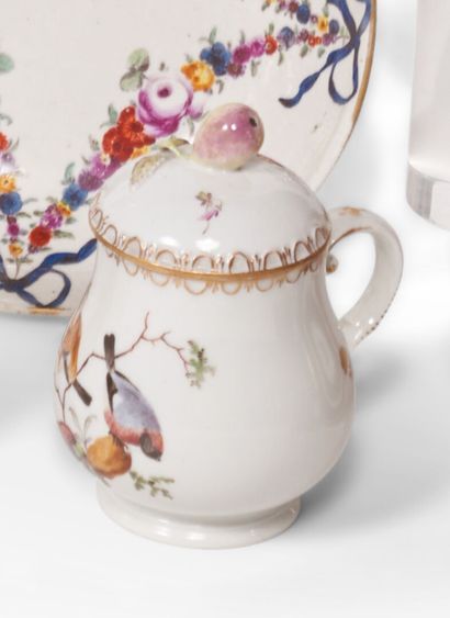 null Fürstenberg
Two porcelain covered juice pots with polychrome decoration of birds...
