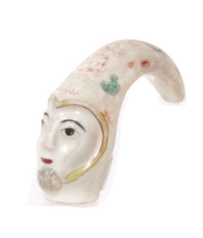null Saint-Cloud
Cane knob in soft porcelain in the shape of a face surmounted by...