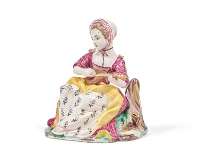null Chantilly or Mennecy
Group in soft porcelain representing a young woman playing...