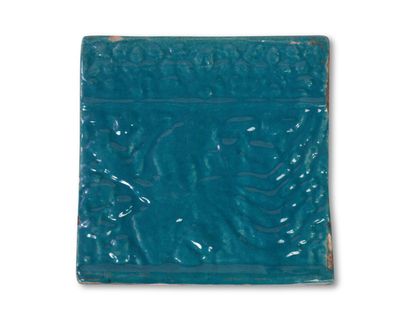 null Iran
Two turquoise monochrome glazed ceramic lining tiles with molded decoration...