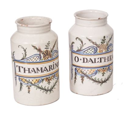 null Midi
Two earthenware cylindrical pharmacy jars with polychrome decoration of...