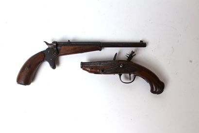 null SET including a flintlock pistol and a revolver, the lock and iron trim, chased...