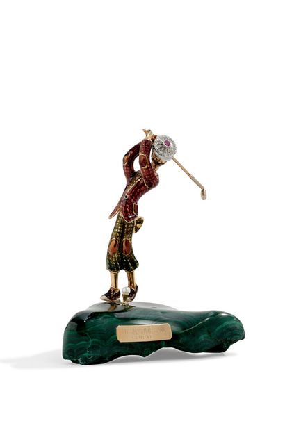 null STATUTE in yellow gold 750 thousandths representing a golfer enamelled in polychromy,...