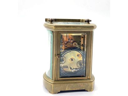 null Officer's clock with brass cage forming an alarm clock.
The dials enamelled...