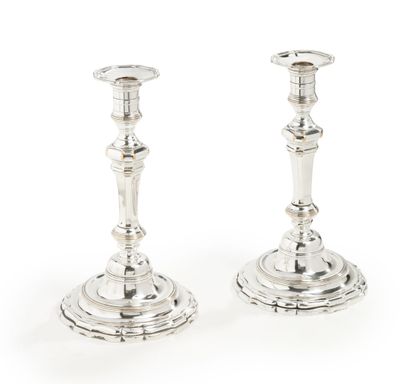 null Pair of silver-plated metal torches on a round base with contours, the shaft...