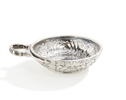 null Silver wine cup posed on rush, decorated in repoussé of stylized pampers and...
