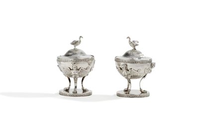 null Pair of silver tripod covered salt cellars standing on a round base, underlined...