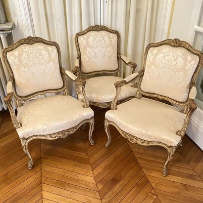 null THREE ARMCHAIRS with curved flat backs in molded wood, carved and lacquered...