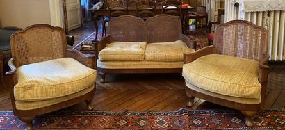 null TWO comfortable armchairs and a small sofa in natural wood, the arms in scroll,...
