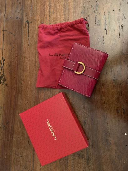 null LANCEL
Red leather wallet. 
In its case and box. 