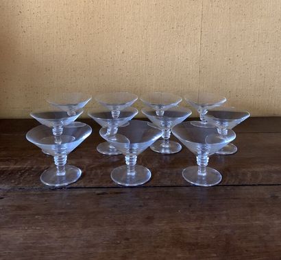 null SAINT LOUIS 
Suite of eleven crystal champagne glasses 
Height 9 cm, Diameter...