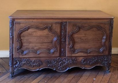 null Normandy BUFFET in oak opening to two doors with richly carved decoration of...