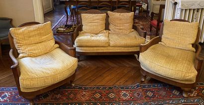null TWO comfortable armchairs and a small sofa in natural wood, the arms in scroll,...