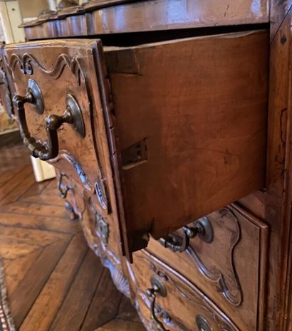 null Provencal walnut COMMODE, the front in crossbow richly carved with shells, interlacing...