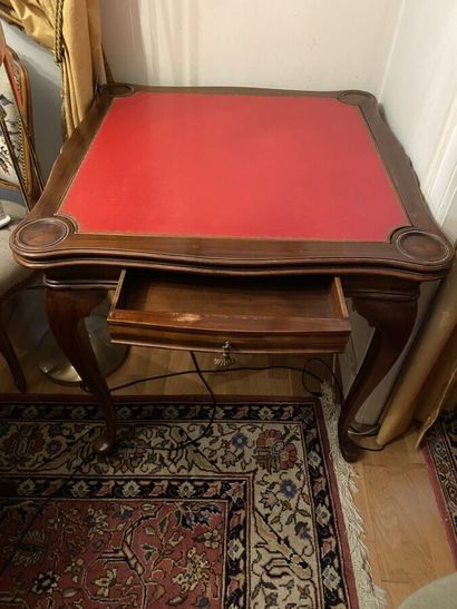 null Square game table in wood veneer opening to a drawer in belt, with several trays...