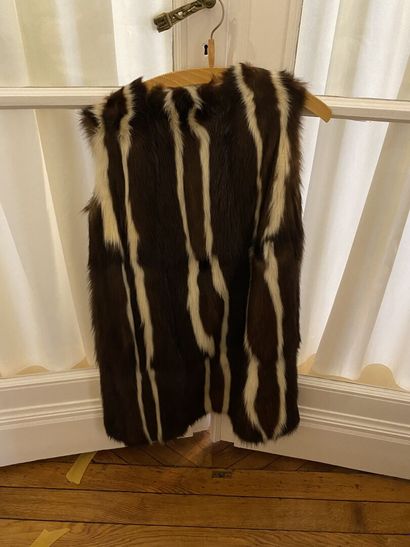 null Set of three long, short, sleeveless fur coats in mink, fox and faux fur, and...