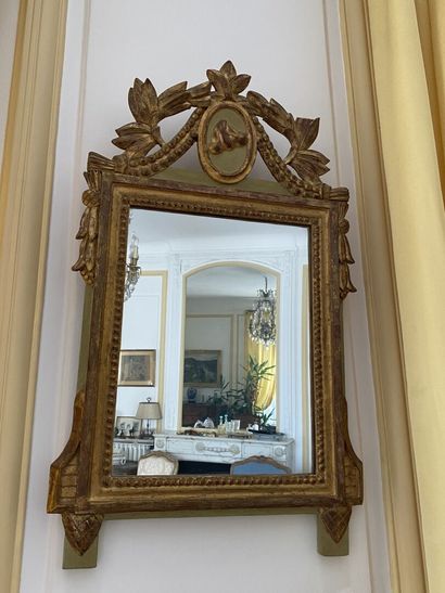 null MIRROR in green lacquered wood and gilded with carved pediment, decorated with...