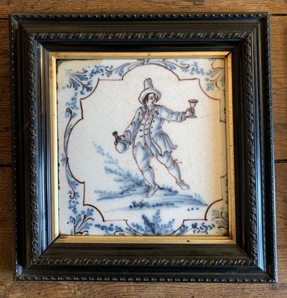 null DELFT
Two earthenware tiles decorated in blue monochrome with characters, a...