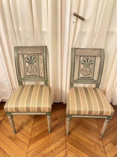 null TWO CHAIRS in green lacquered wood, the back decorated with openwork stars and...