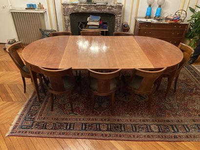 null Dining room table of oval shape and twelve chairs and two armchairs in mahogany...
